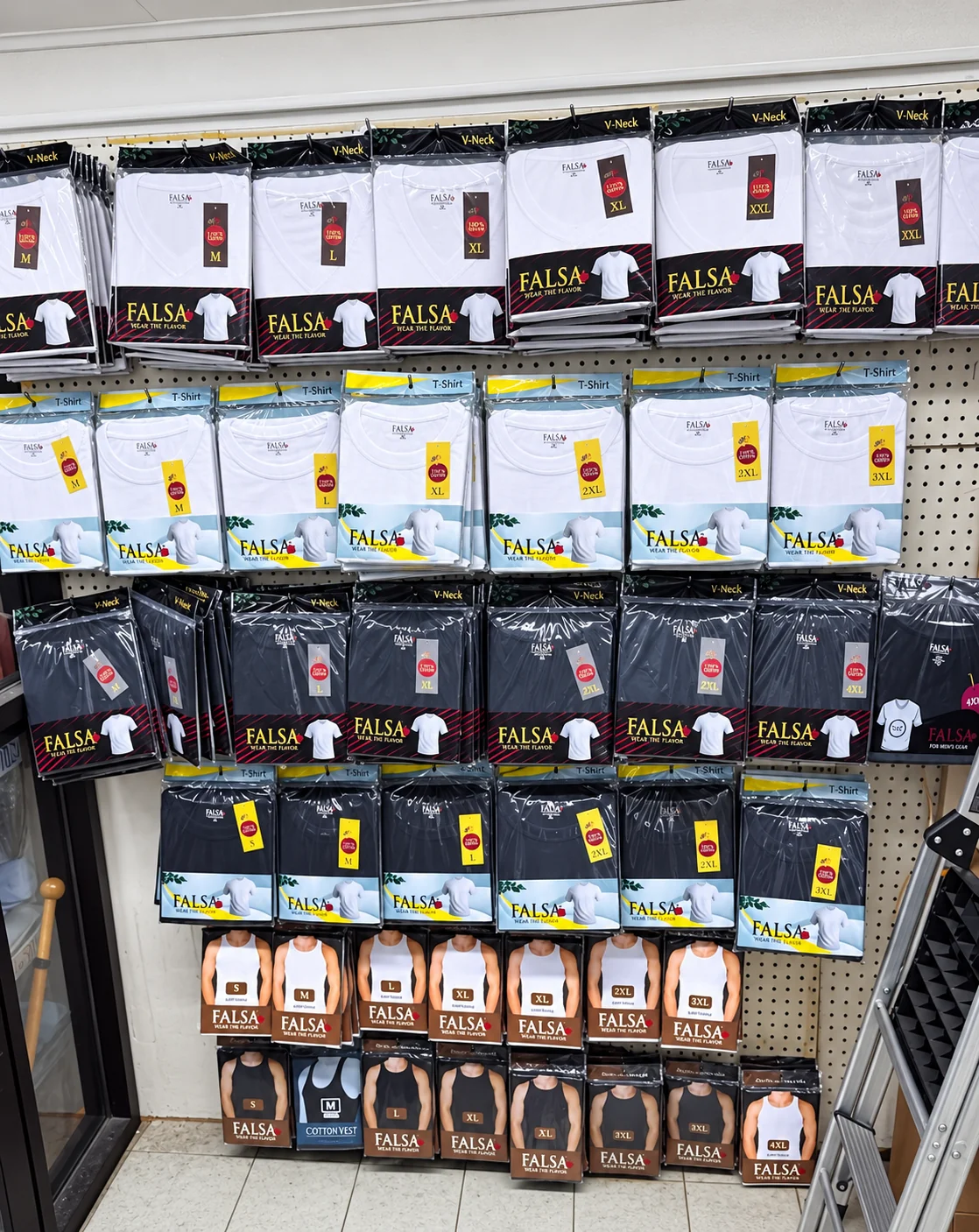 FALSA shirts displayed on a store rack